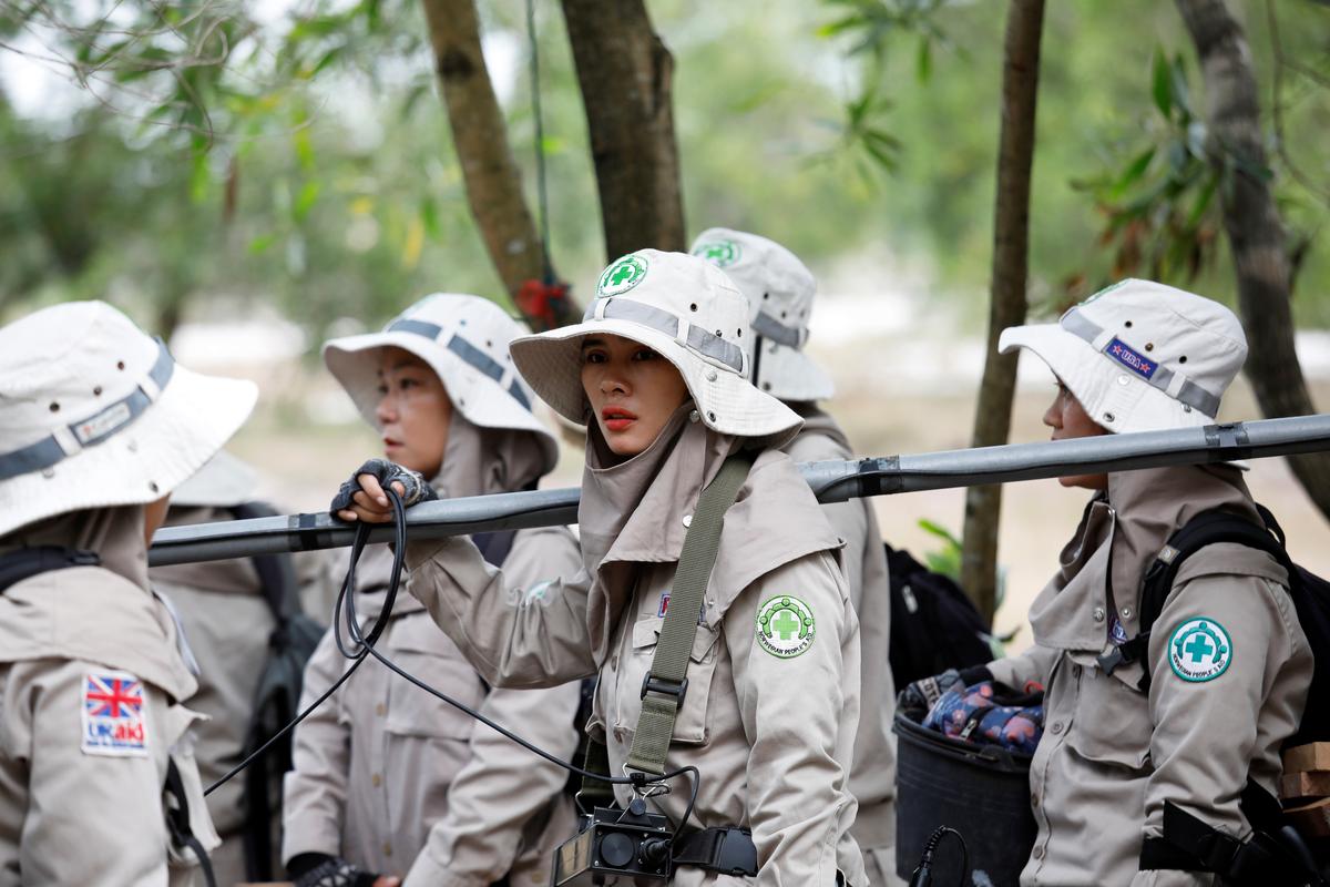Members of all-female landmines clearance team get ready for their work on a field in Quang Tri province, Vietnam March 4, 2020. Picture taken March 4, 2020. Photo: Reuters