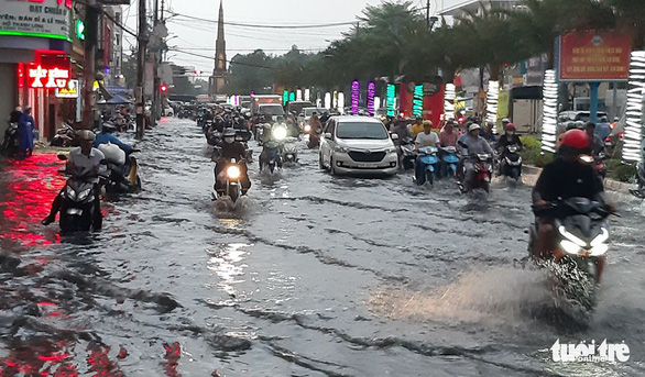 Precious rain floods Vietnam’s Mekong Delta city amid historic drought