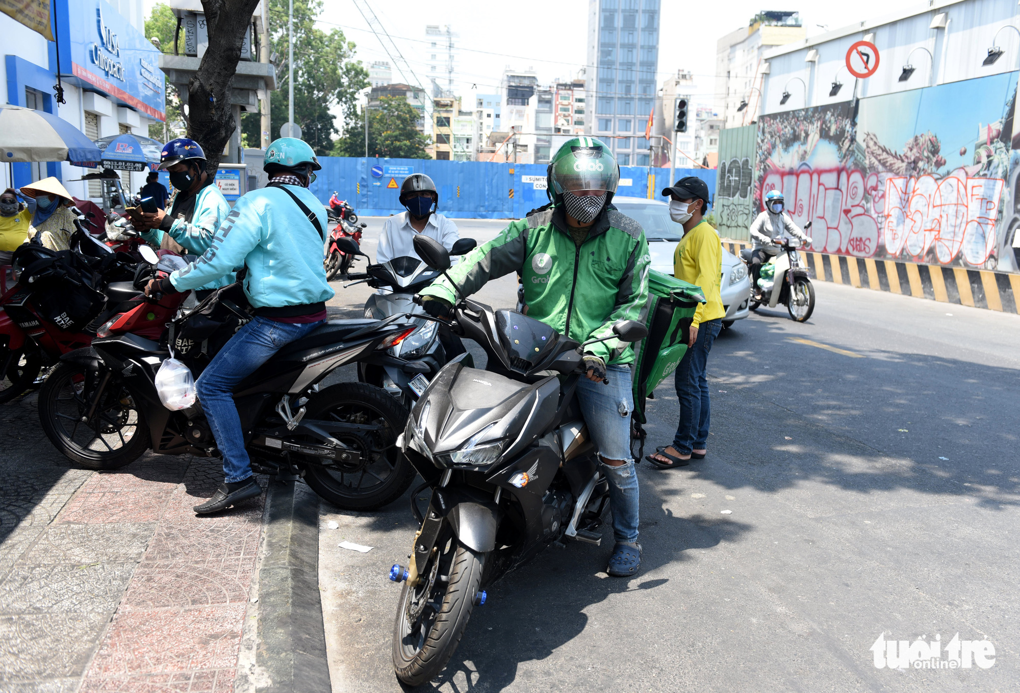 Delivery drivers are seen outside a restaurant in Ho Chi Minh City, Vienam. Photo: Duyen Phan / Tuoi Tre