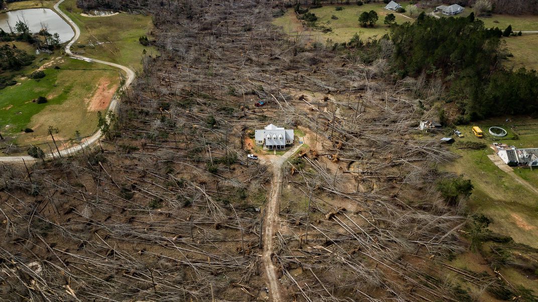 The photo ‘Home survives direct hit from tornado’ by Matt Gillespie wins the Readers’ Choice award of the 17th annual Smithsonian magazine photo contest. The home was in the direct line of a tornado that hit Ellerslie, Georgia. Most of the trees on the property had fallen, but the house stood with minimal damage.