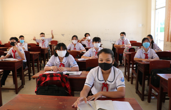 Ninth-grade students sit two meters apart on their first day at school after a three-month COVID-19 break in Ca Mau Province, Vietnam, April 20, 2020. Photo: Nguyen Hung / Tuoi Tre