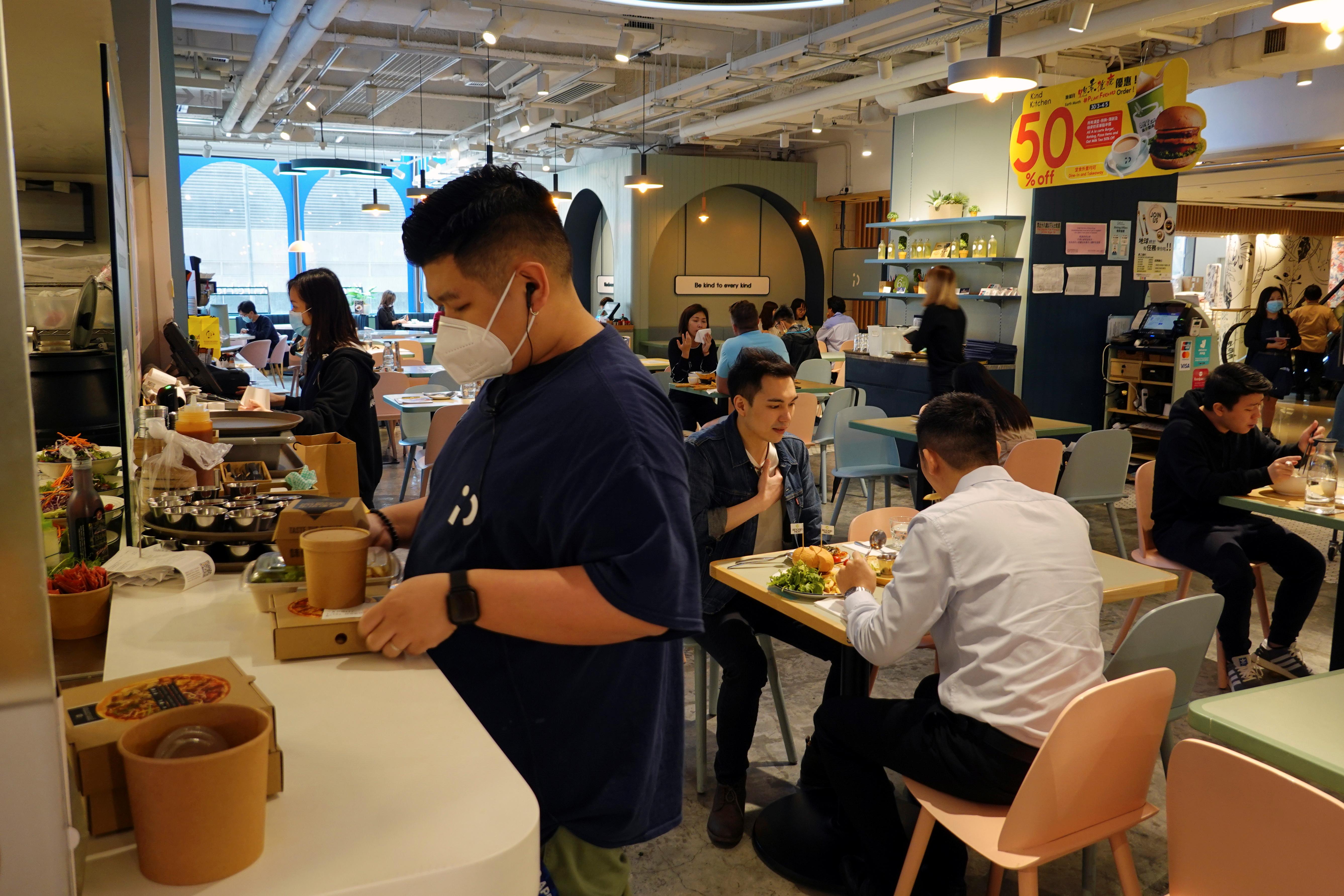 Customers dine at a vegan restaurant Kind Kitchen that serves plant-based meat in Hong Kong, China April 17, 2020. Picture taken April 17, 2020. Photo: Reuters