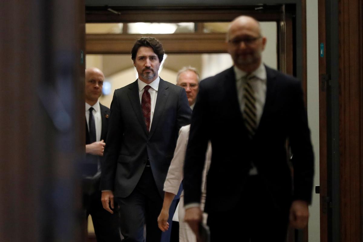 Canada's Prime Minister Justin Trudeau arrives with government ministers to a news conference on Parliament Hill in Ottawa, Ontario, Canada May 1, 2020. Photo: Reuters