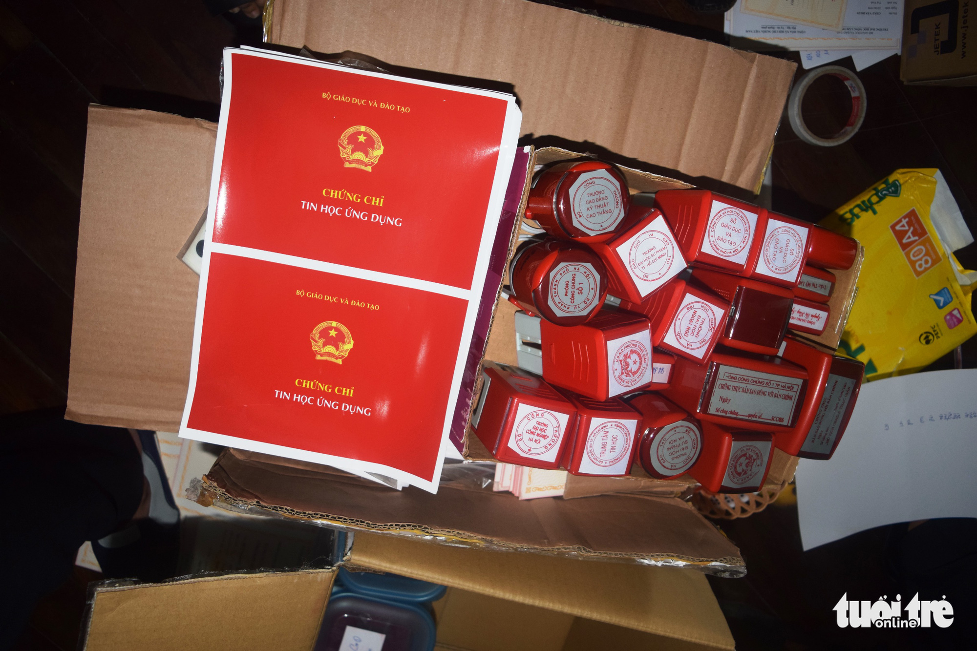 Fake seals and degree certificates seized by police in Thua Thien – Hue Province, Vietnam are seen in this photo. Photo: Thuong Hien / Tuoi Tre