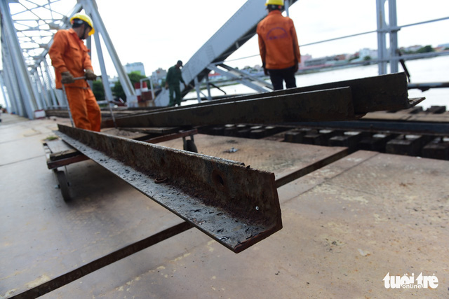 Workers are seen working on the dismantlement of the 118-year-old Binh Loi Railway Bridge in Ho Chi Minh City, Vietnam, May 8, 2020. Photo: Quang Dinh / Tuoi Tre