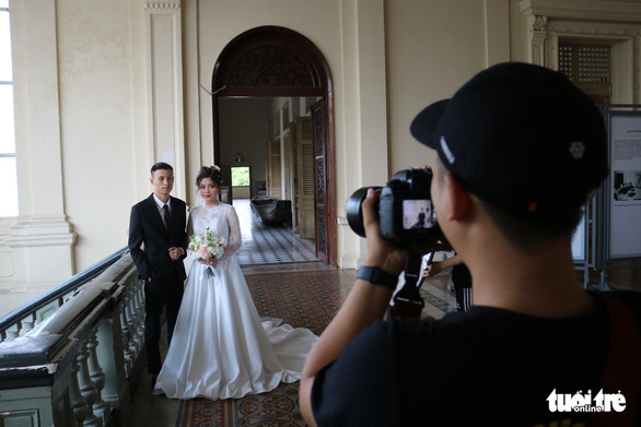 Do Chien Thang (left), 21, and Huynh Nhu, 19, are seen taking pre-wedding photos in Ho Chi Minh City, Vietnam, May 13, 2020. Photo: Ngoc Phuong / Tuoi Tre