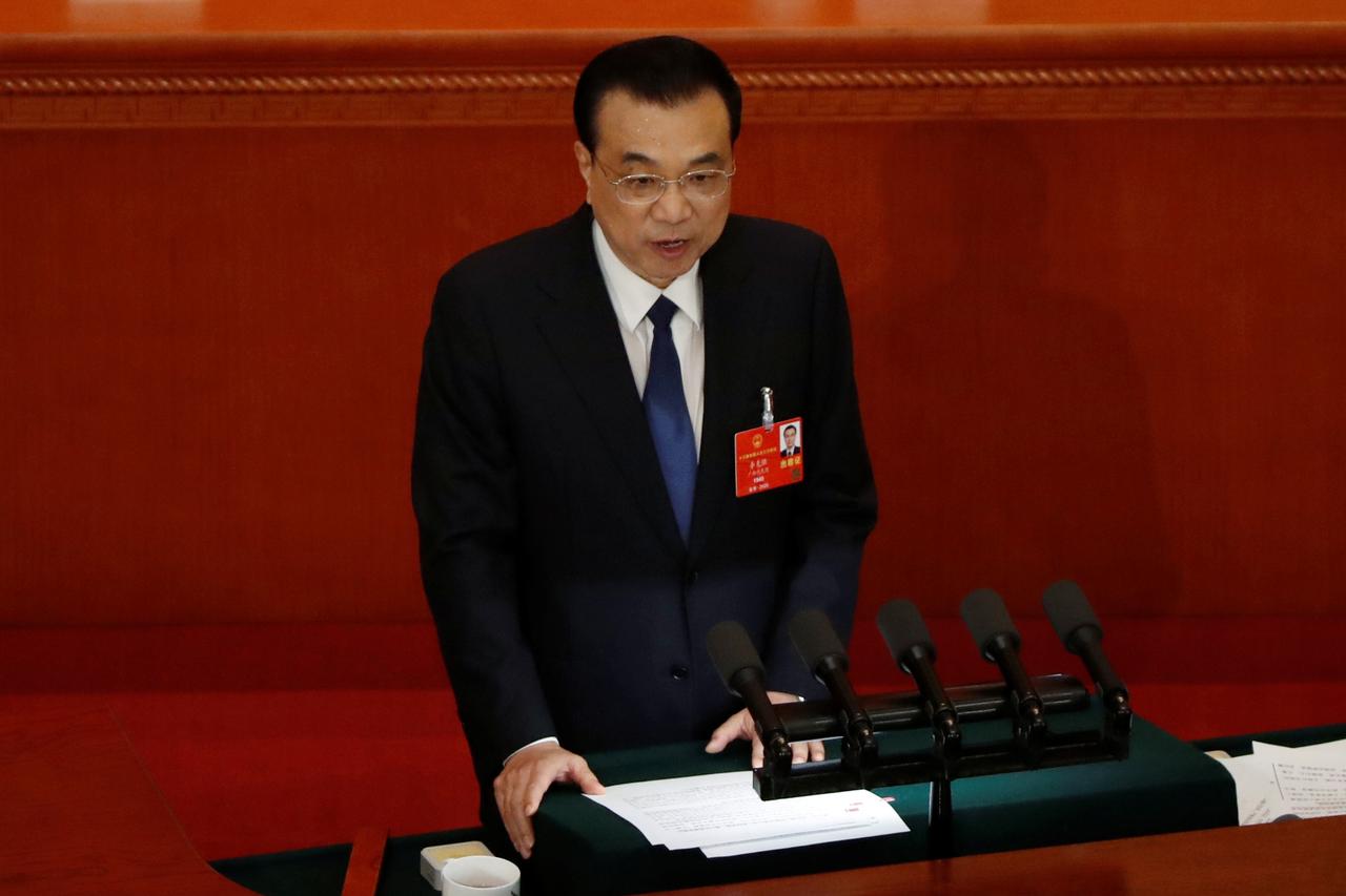 China drops GDP goal, pledges higher spending as parliament starts