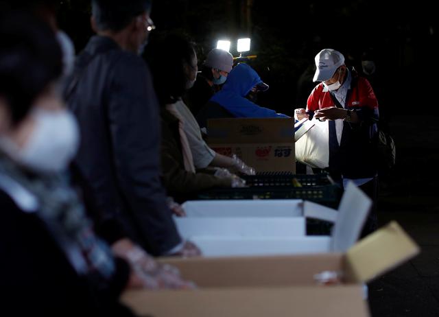 Japan's elderly workers, once key to Abenomics, suffer as pandemic closes businesses