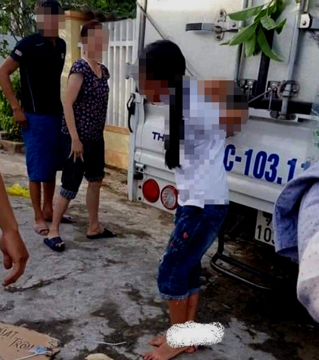 In Vietnam, girl tied up to truck by family for stealing