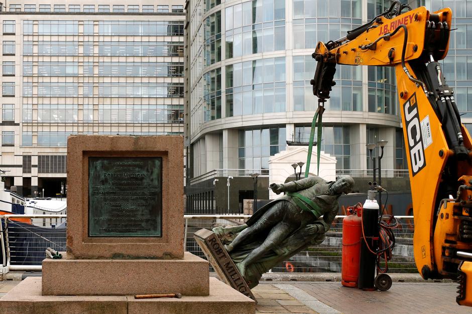 Confronting a bygone era, London removes slave trader statue