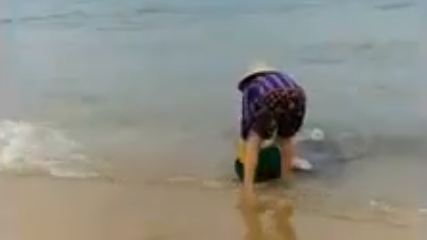 Video shows woman dumping garbage on Vietnam beach, taunting onlooker