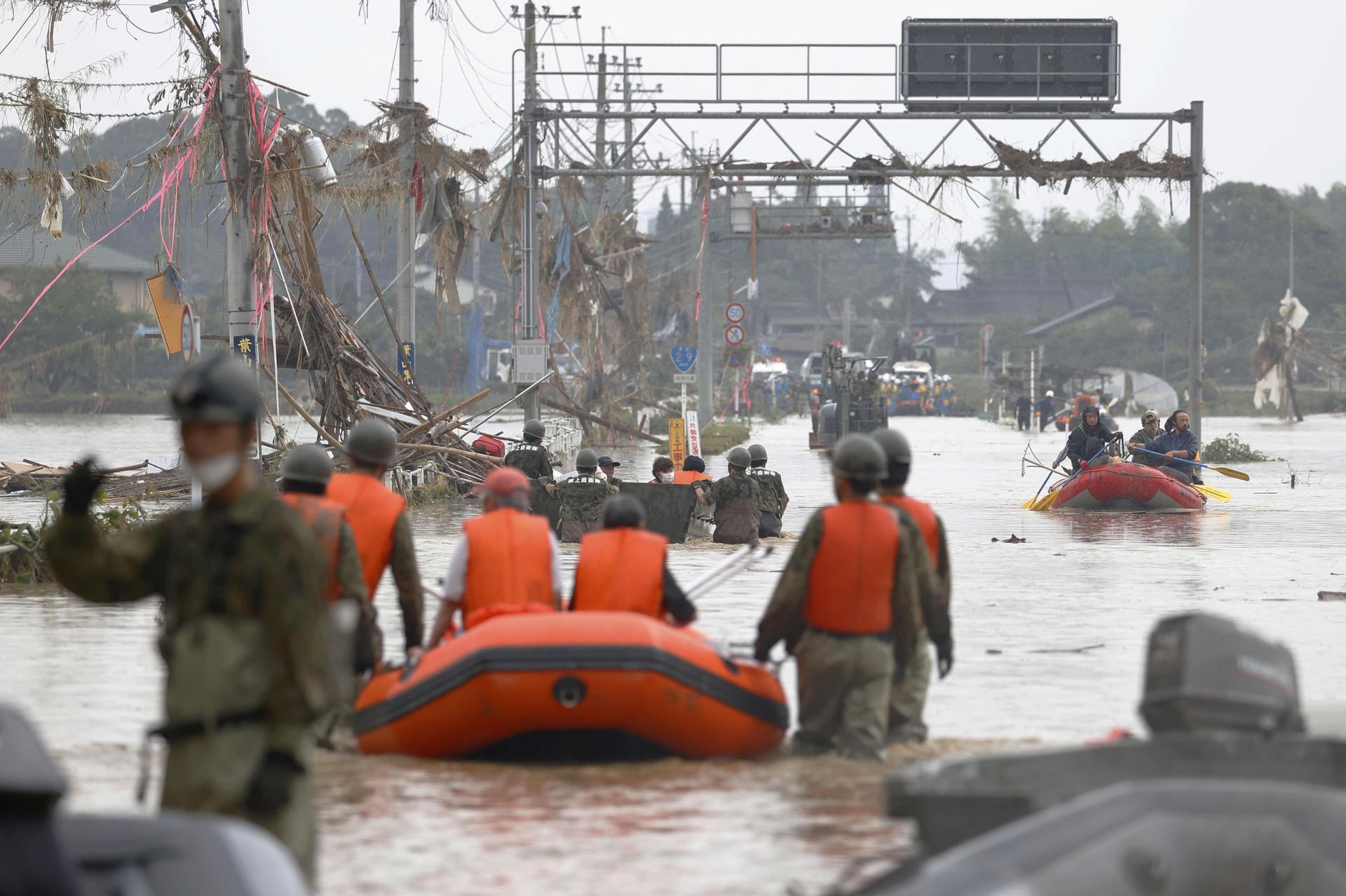 Flood death toll hits 20 as Japan warned of more rainfall