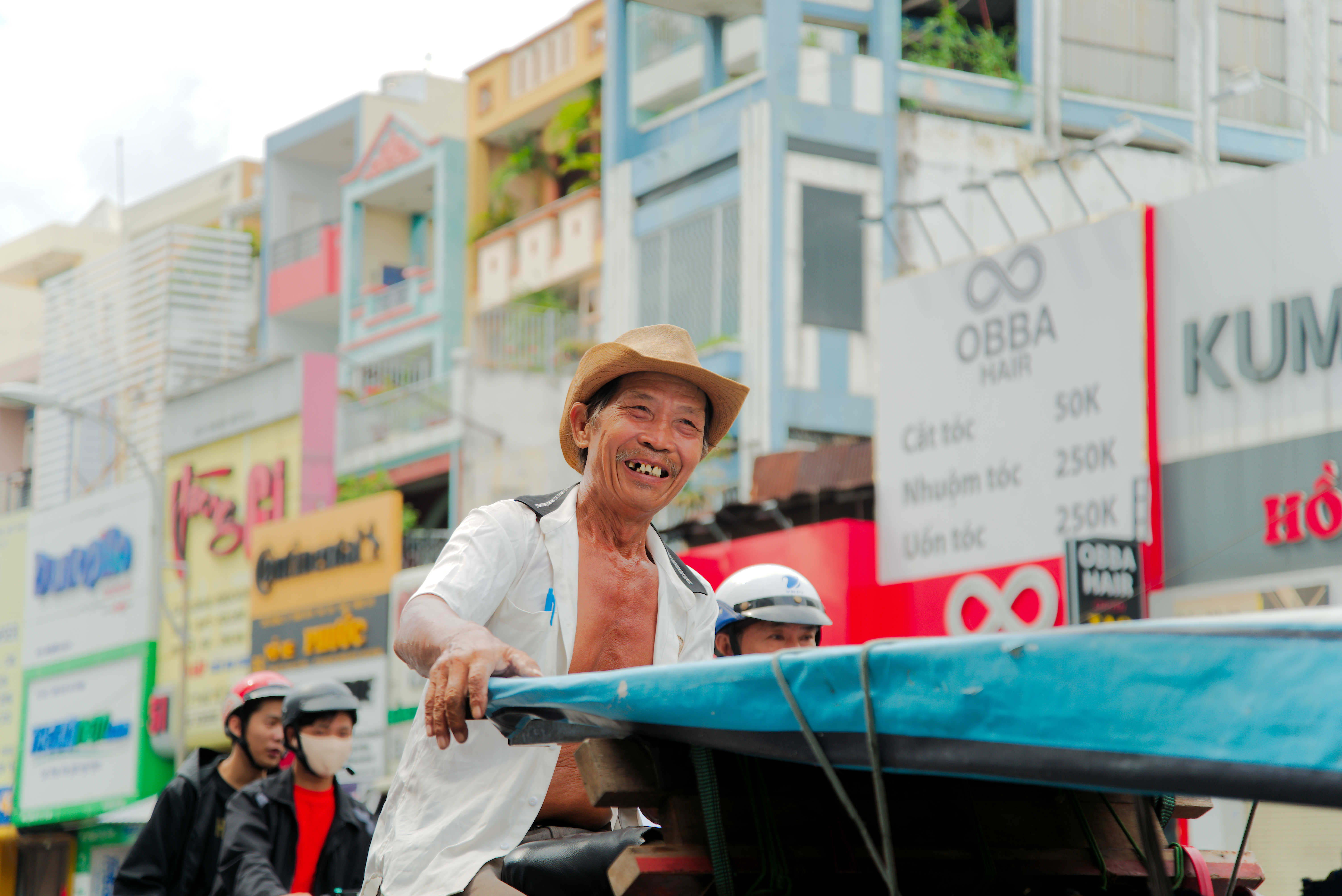 A cyclo driver on Vietnam street through Nunas' lens