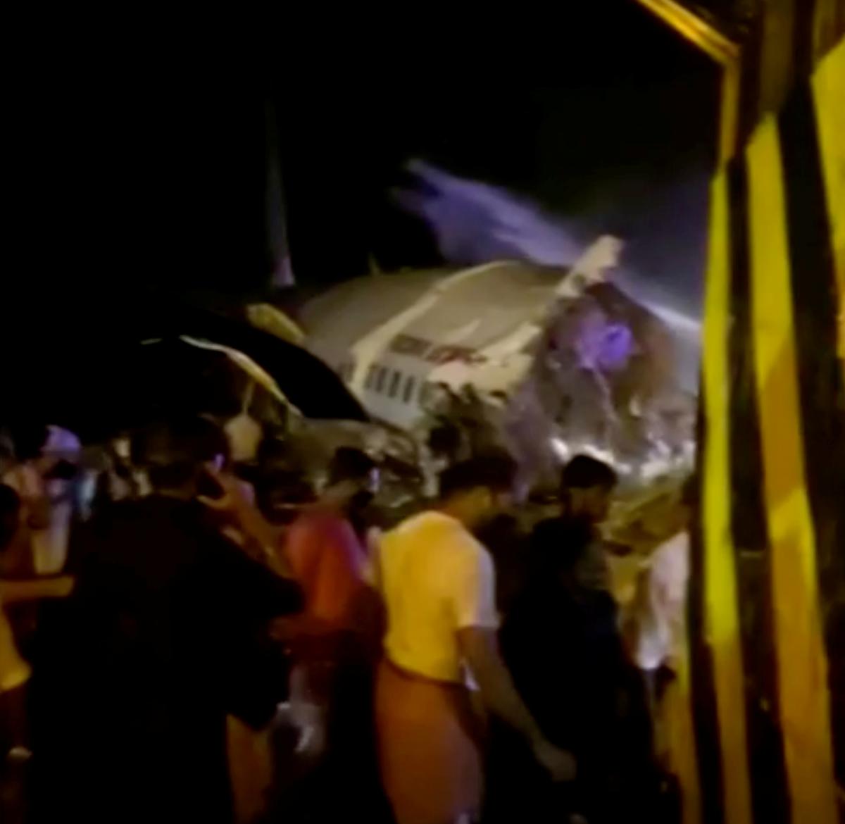 A passenger plane that crashed after it overshot the runway is seen at Calicut International Airport in Karipur, southern state of Kerala, India, August 7, 2020, in this still image obtained from a video. Photo: Reuters
