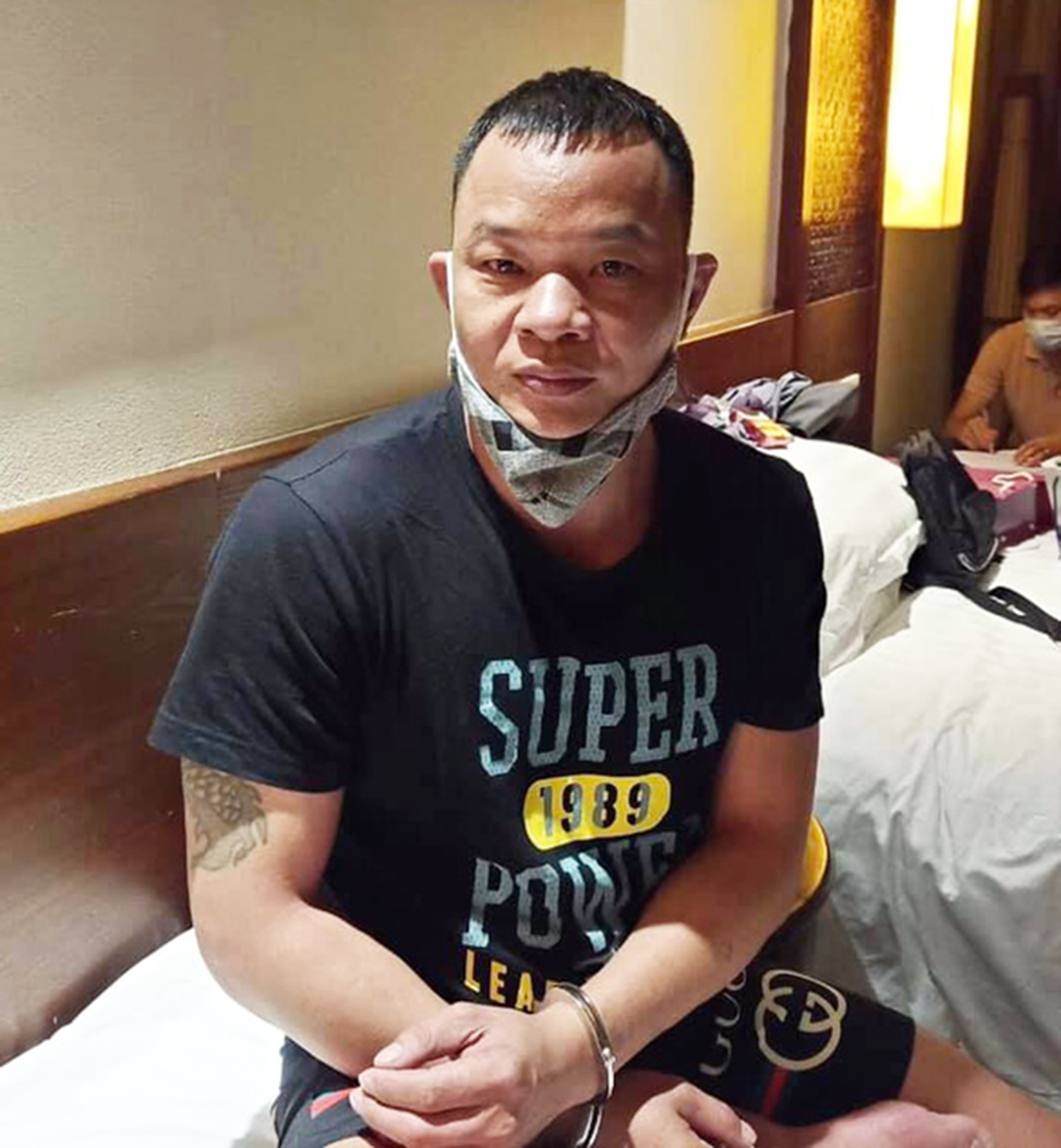 China’s Gao Liang Gu, 40, is arrested in Vietnam for smuggling people into the Southeast Asian nation in a photo provided by police officers in Quang Nam Province, Vietnam.