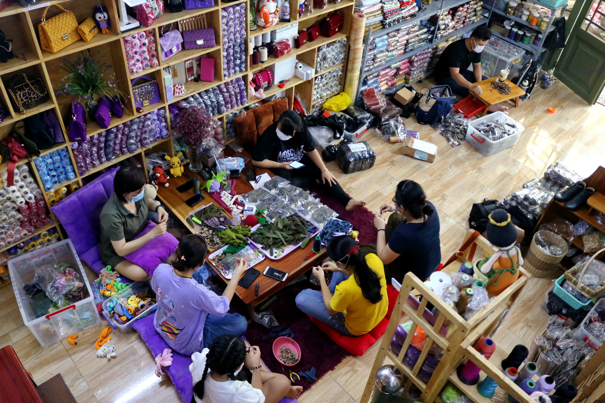 Phan Thi Thuong’s knitting group makes wool ear savers at their workshop in Tan Phu District, Ho Chi Minh City. Photo: Hoang An / Tuoi Tre