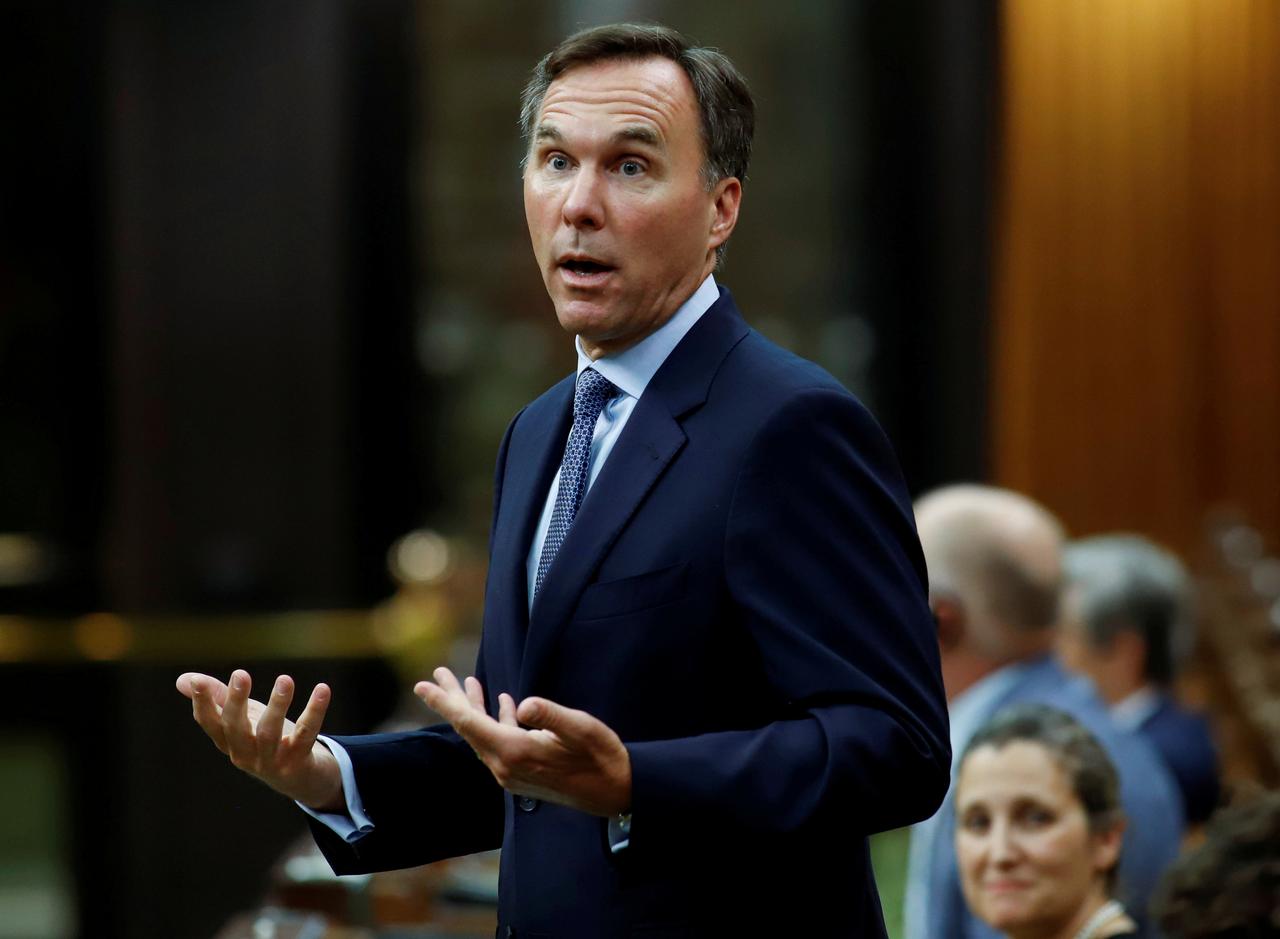 Canada finance minister resigns amid friction with Trudeau and charity scandal