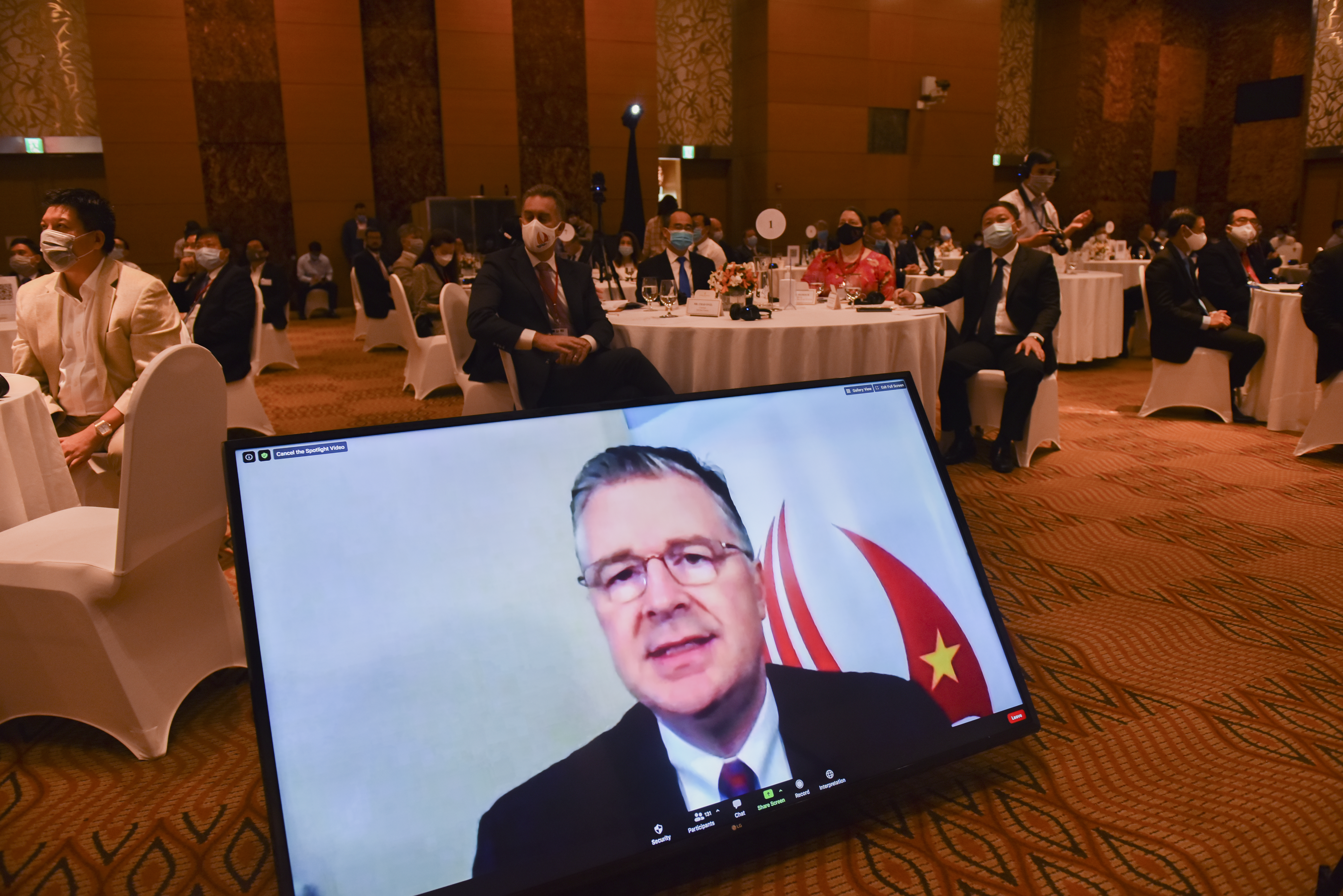 A monitor shows Daniel Kritenbrink, United States Ambassador to Vietnam, speaking at the signing ceremony of the grant funding for a smart cities project between the U.S. Trade and Development Agency and Ho Chi Minh City, August 25, 2020. Photo: The American Center in Ho Chi Minh City