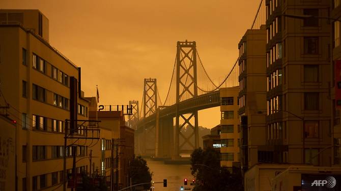 The San Francisco Bay Bridge is seen along Harrison Street under an orange smoke-filled sky in San Francisco, California on Sep 9, 2020. Photo: AFP