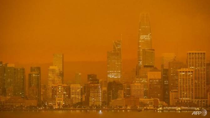 The San Francisco skyline is obscured in orange smoke and haze as their seen from Treasure Island in San Francisco, California on Sep 9, 2020.  Photo: AFP