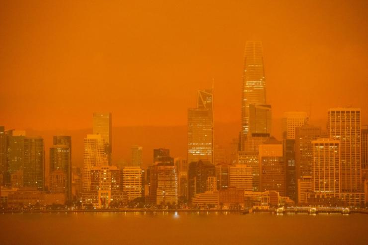 The San Francisco skyline is obscured in orange smoke and haze from the fires. Photo: AFP