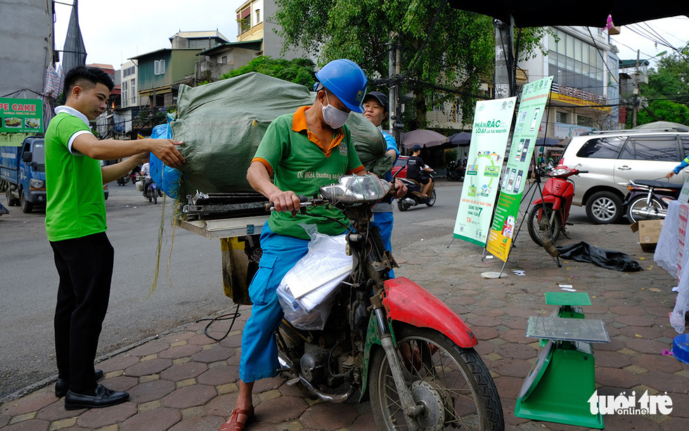 Hanoi people exchange trash for gifts on weekends