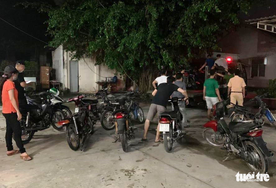 Officers confiscate multiple motorbikes after breaking up the theft ring in Ho Chi Minh City in this supplied photo.