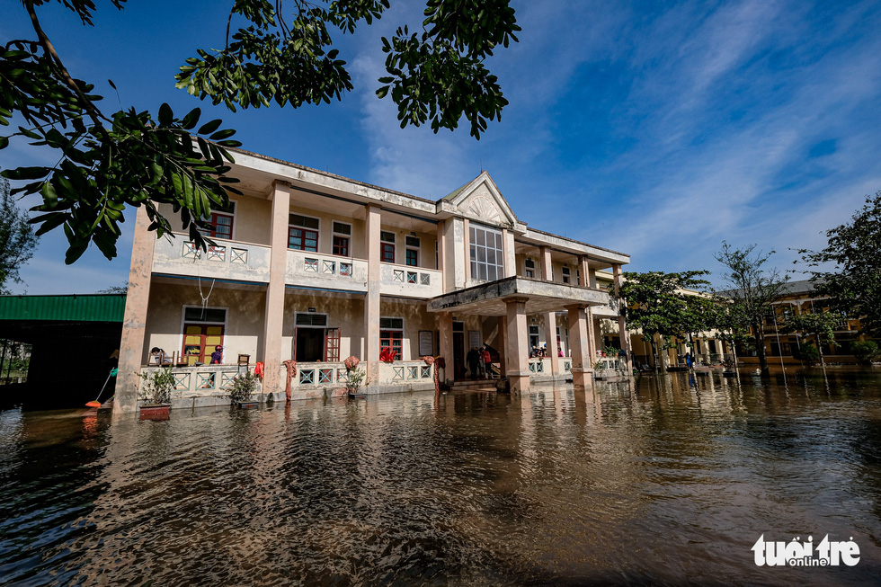 The Cam Quang Elementary School in Ha Tinh Province is seen knee-deep in water in this photo taken on Thursday. Photo: Nam Tran / Tuoi Tre