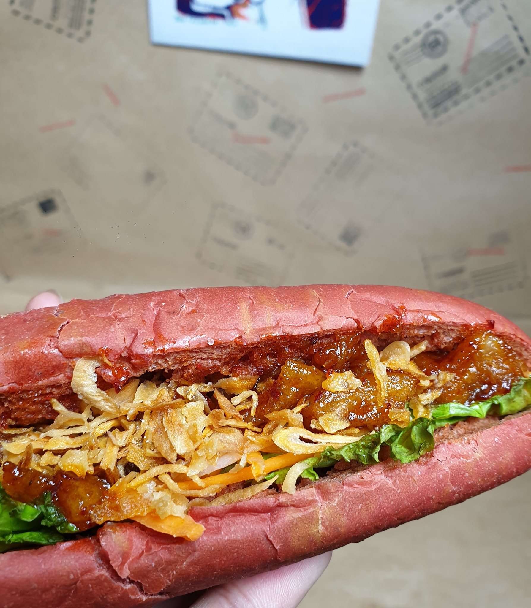 A loaf of banh mi filled with fried pork fat and onion at the Cyburger by Homekekery in Hanoi. Photo: Supplied
