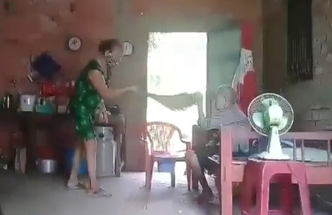 Nguyen Thi Hoa abuses her elderly mother in this screenshot taken from the video footage.