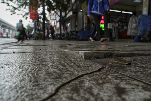 The paving on Hanoi’s Nguyen Trai Street is warped in this photo. Photo: Pham Tuan / Tuoi Tre