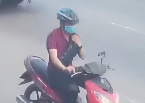 Tran Cong Duc is caught on CCTV riding a motorbike following the bank robbery in Binh Duong Province, Vietnam, November 18, 2020.