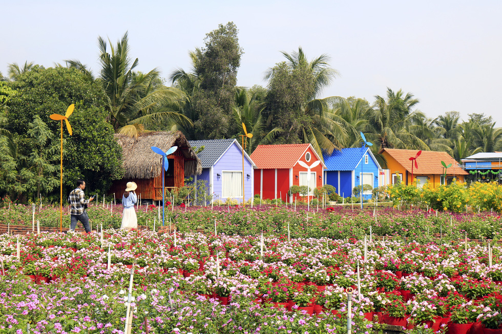 Vibrantly-colored cabins are seen at a botanical garden in Ho Chi Minh City’s Nhi Binh Ward.