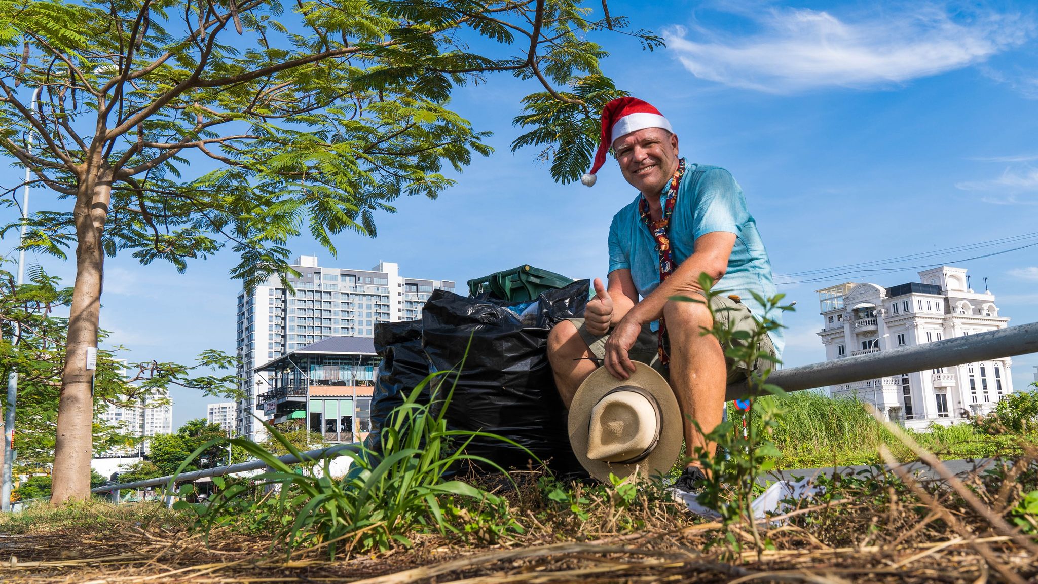 John Petter Klovstad from Norway poses for a picture with a bag of rubbish he picked up during his morning jogging routine in December in Ho Chi Minh City. Photo: Supplied