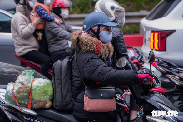 Fresh produce is loaded on a motorbike heading to Hanoi after New Year’s holiday weekend, January 3, 2021. Photo: Pham Tuan / Tuoi Tre