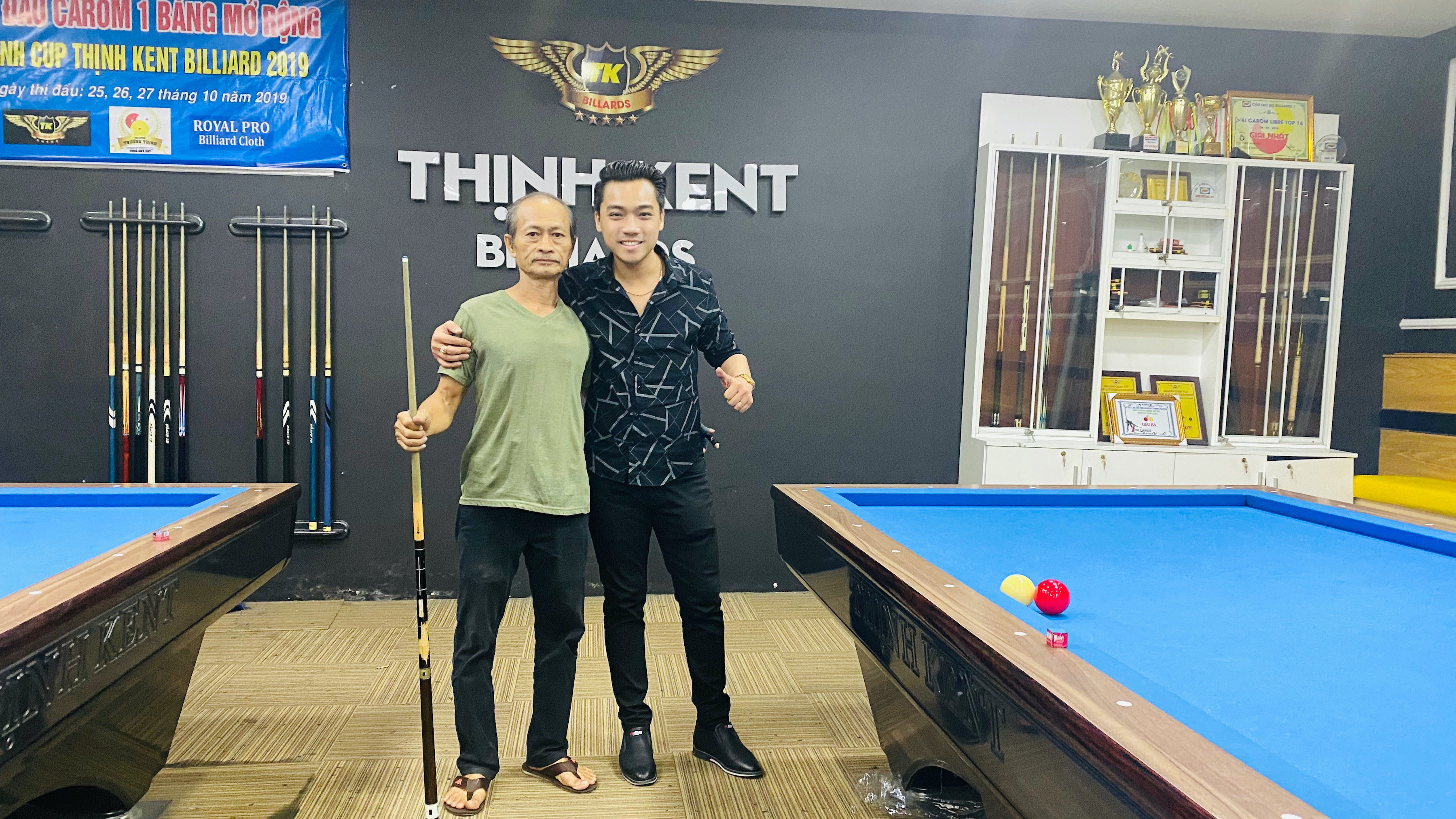 This supplied photo shows Huynh Truong Thinh (right) and his billiards mentor, Truong, at a club in Ho Chi Minh City.