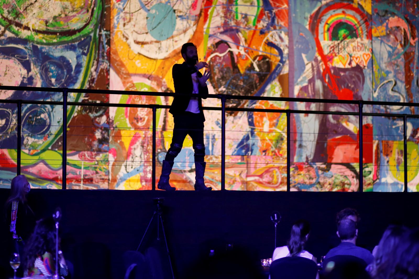 British artist Sacha Jafri speaks during an auction of his paintings at the Atlantis hotel in Dubai, United Arab Emirates March 22, 2021. Picture taken March 22, 2021. Photo: Reuters