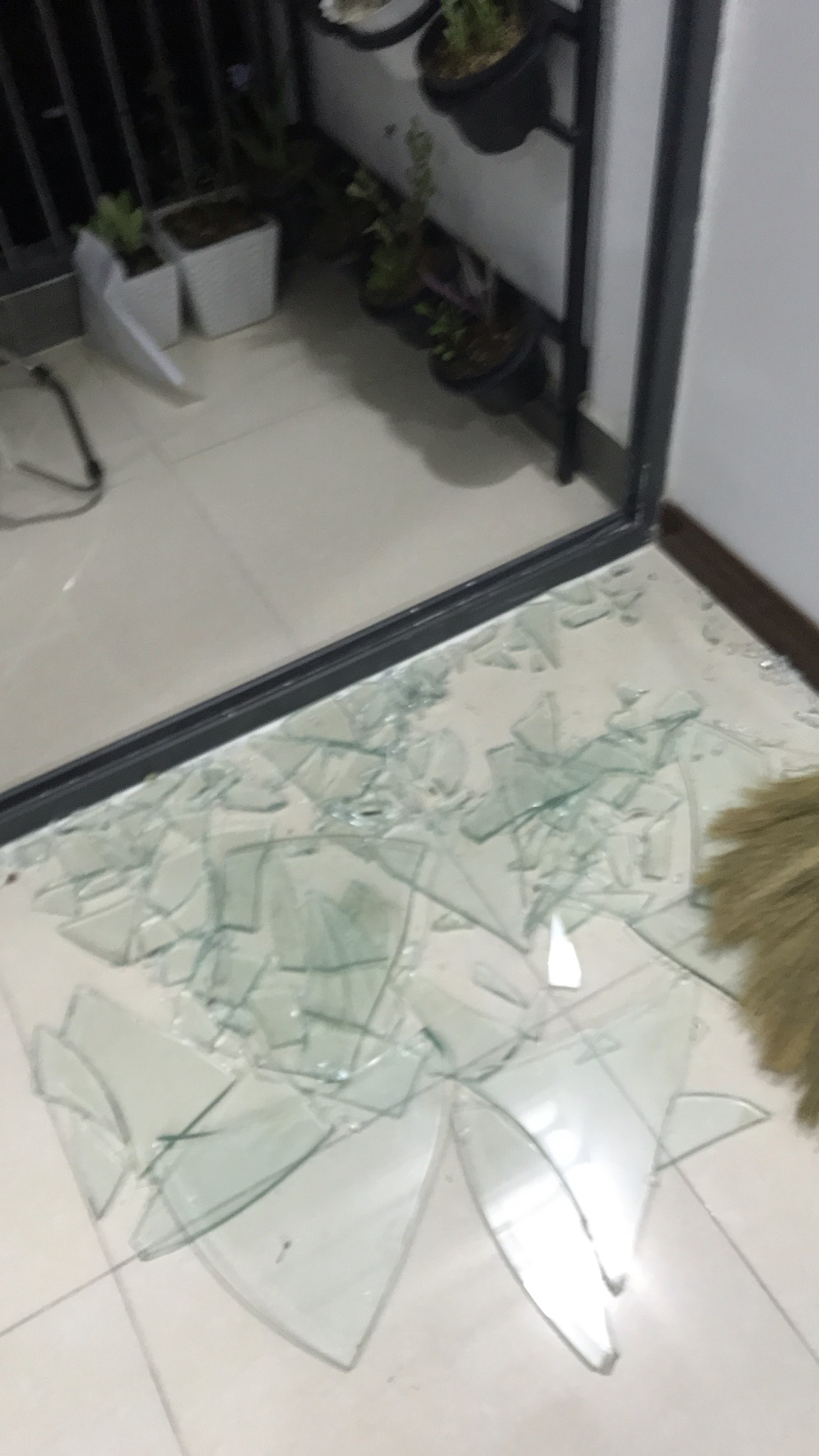 This supplied photo shows glass on a sliding door broken into pieces at the P.H Nha Trang apartment complex in Nha Trang City, Khanh Hoa Province, Vietnam.