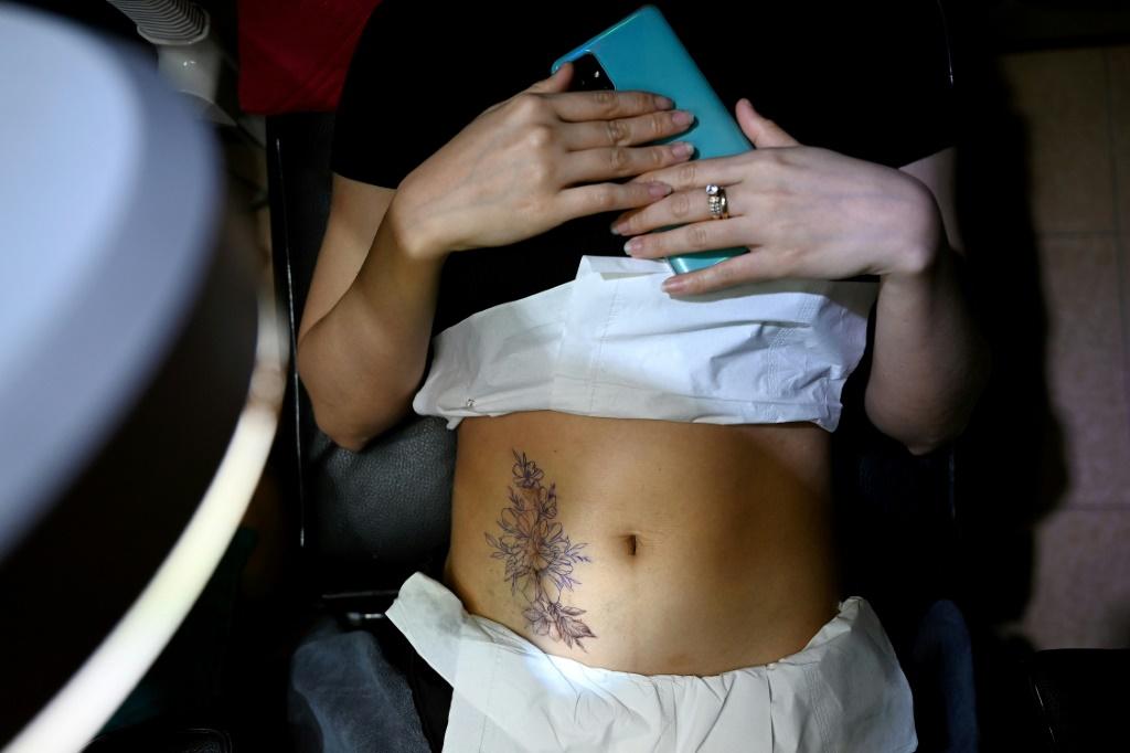 Ngoc says getting inked is often a landmark moment in her clients' lives. Photo: AFP