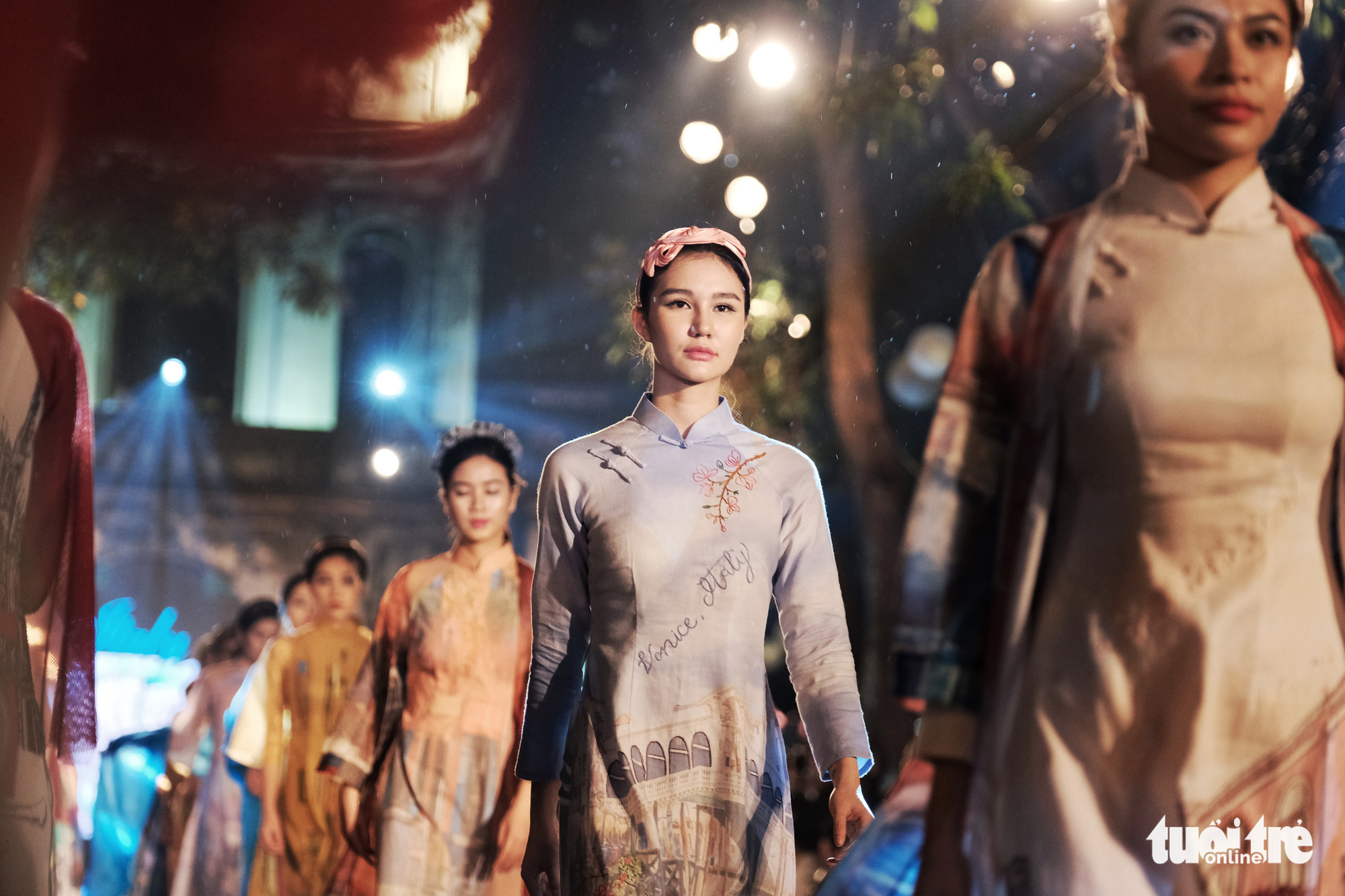 Models showcase ao dai (Vietnamese traditional costume) at an event titled 'Our Ao Dai' at Hanoi's Temple of Literature on April 9, 2021. Photo: Mai Thuong / Tuoi Tre