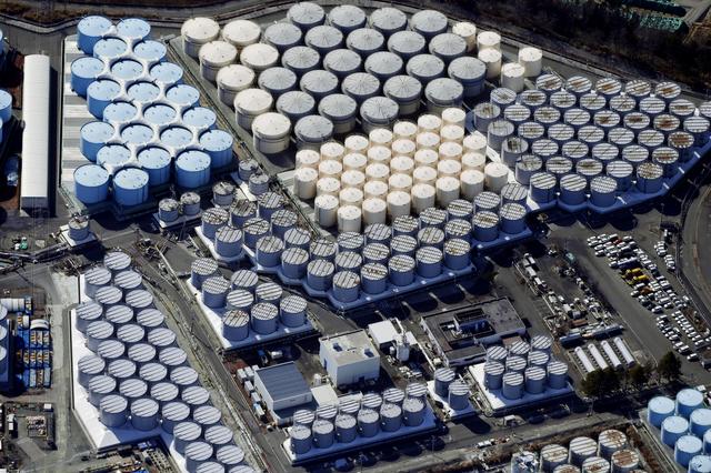 An aerial view shows the storage tanks for treated water at the tsunami-crippled Fukushima Daiichi nuclear power plant in Okuma town, Fukushima prefecture, Japan February 13, 2021, in this photo taken by Kyodo.  Kyodo/via REUTERS