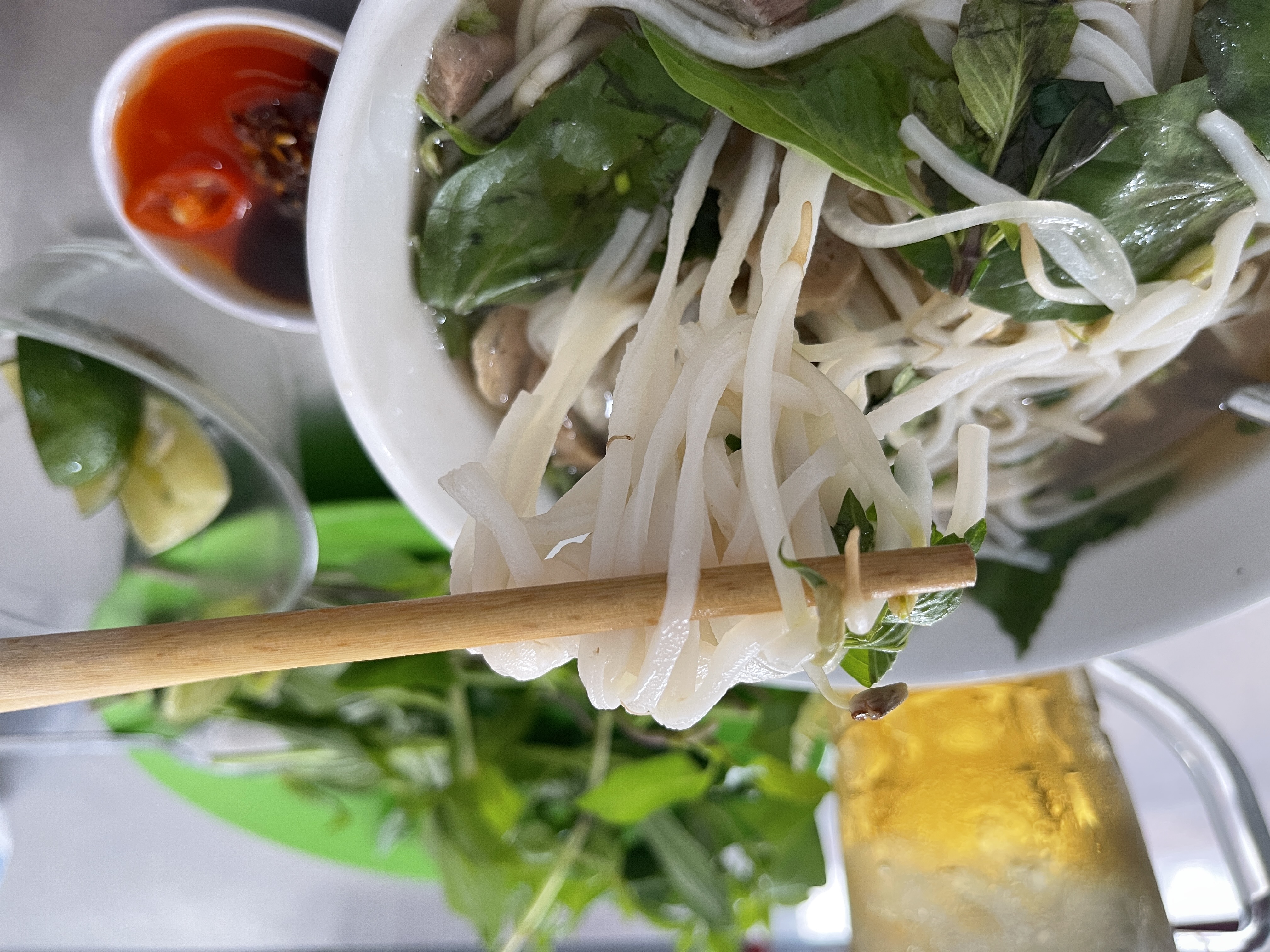 An illustration photo shows people in southern Vietnam like to add veggies and hoisin sauce to the bowl of pho. Photo: Dong Nguyen / Tuoi Tre News
