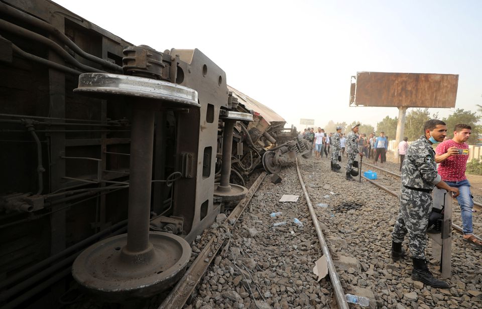 Egyptian police officers stand guard at the site where train carriages derailed in Qalioubia province, north of Cairo, Egypt April 18, 2021. Photo: Reuters