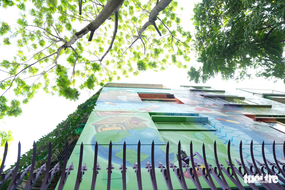 Colorful coronavirus-inspired murals are displayed on the walls of a house at the Van Phu residential quarter in Ha Dong District, Hanoi. Photo: Ha Thanh