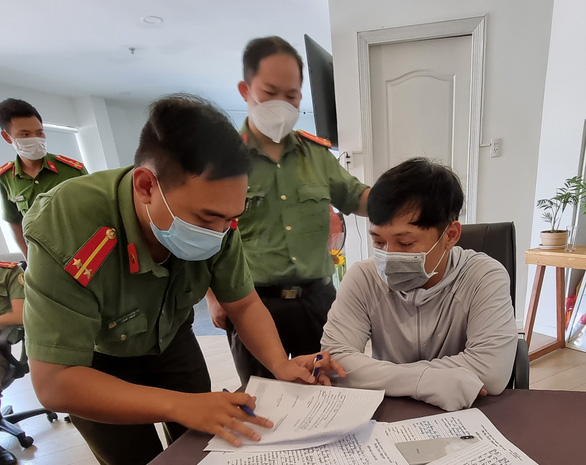 In this supplied photo, Le Xuan Thanh is seen at his office, in Da Nang City, where a police search is underway on May 15, 2021.