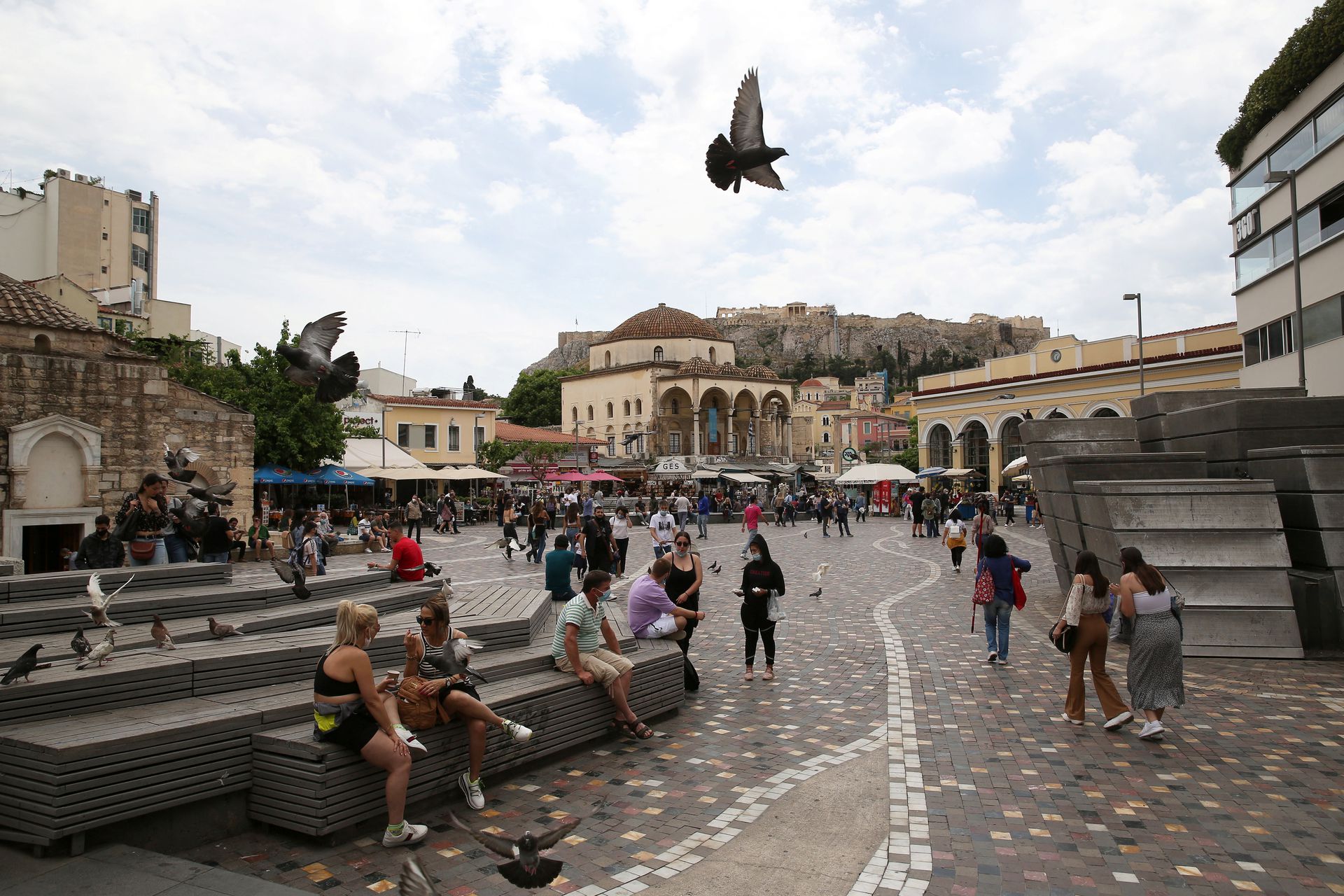 People make their way around Monastiraki square, as the country's tourism season officially opens, in Athens, Greece May 15, 2021. Photo: Reuters