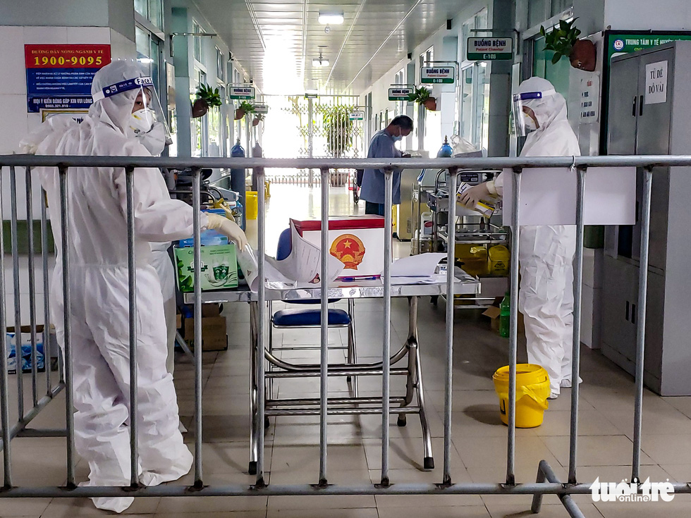 Medical officers prepare ballot box, ballots and other polling necessities at Makeshift Hospital No.1, Bac Ninh Province, VIetnam, May 22, 2021.