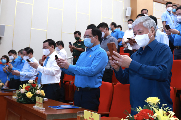 In this supplied photo, participants of the text-to-donate program launching ceremony are seen sending donation messages from their mobile phones to number 1408 on June 3, 2021.