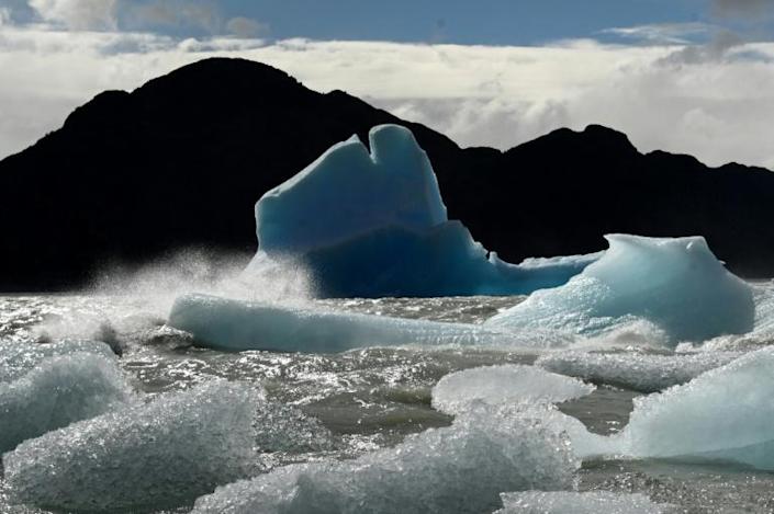 Greenhouse gas emissions are locking in global heating that is melting ice sheets and glaciers and expanding oceans. Photo: AFP