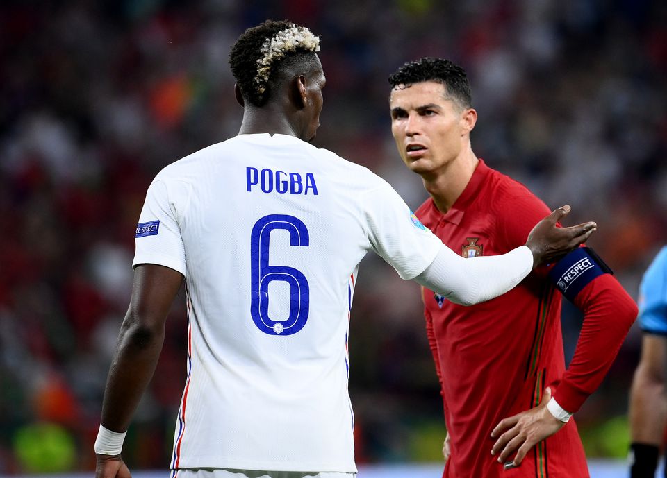 Soccer Football - Euro 2020 - Group F - Portugal v France - Puskas Arena, Budapest, Hungary - June 23, 2021 France's Paul Pogba speaks with Portugal's Cristiano Ronaldo during the match. Photo: Pool via Reuters
